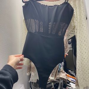 black adjustable strap body suit